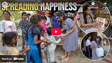 Distribution of stationery kits to children in a Basti